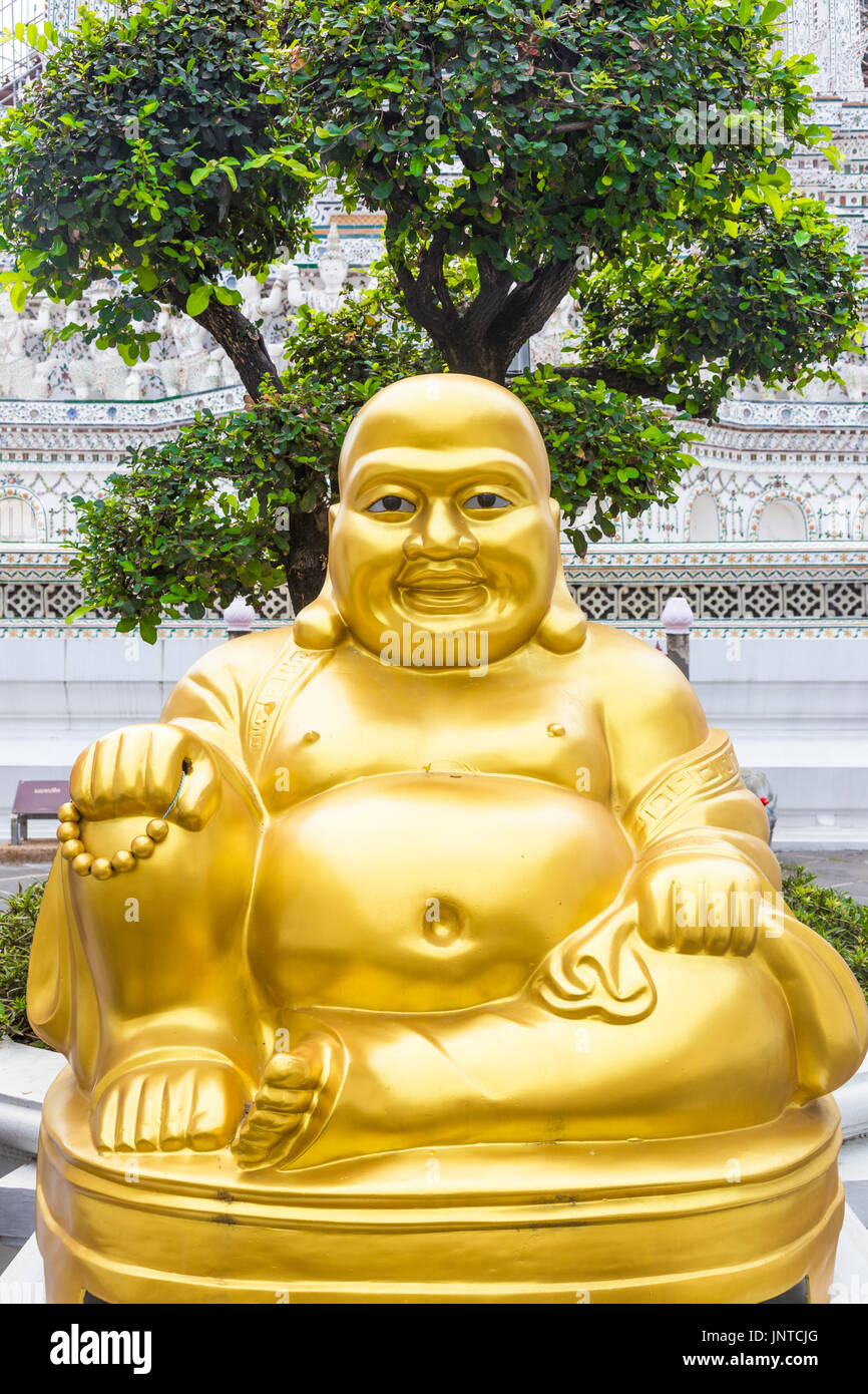 Statue of smiling fat golden buddha (Chinese God of Happiness) at Wat